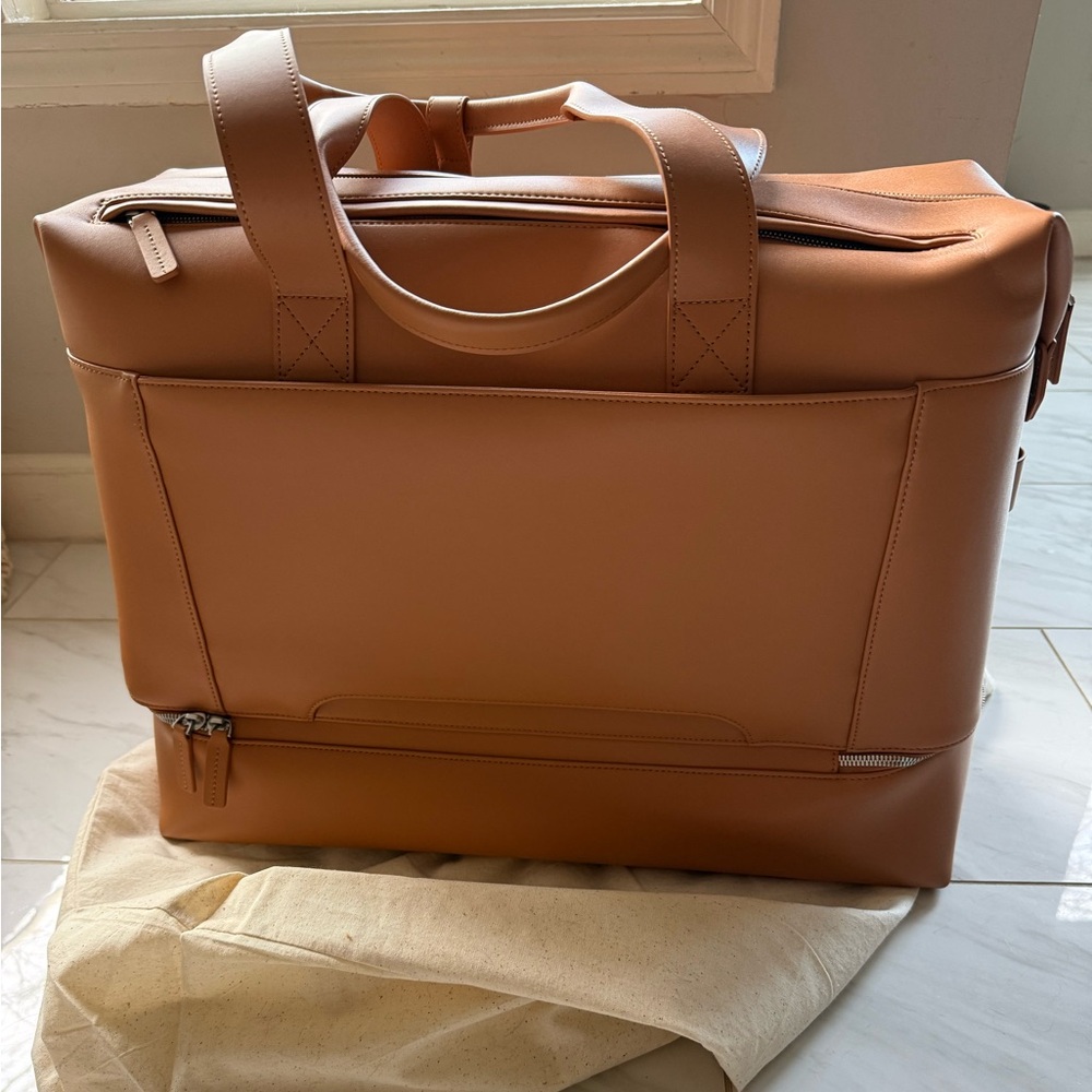 Monos - Metro Weekender color: saddle tan new never used with duster bag